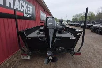 Slide: The Image of 2022 Alumacraft Competitor 165 SC boat displayed at a dealership. - 5