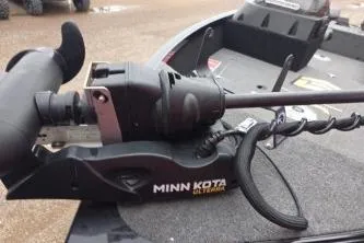 Slide: The Image of Minn Kota trolling motor on 2022 Alumacraft Competitor 165 SC boat deck. - 6