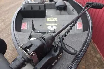 Slide: The Image of 2022 Alumacraft Competitor 165 SC boat interior with trolling motor and seating. - 8