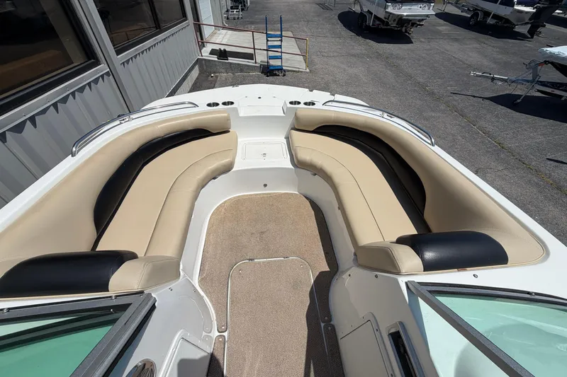 Slide: The Image of 2016 Hurricane SunDeck 187 OB boat interior with beige and black seating. - 4