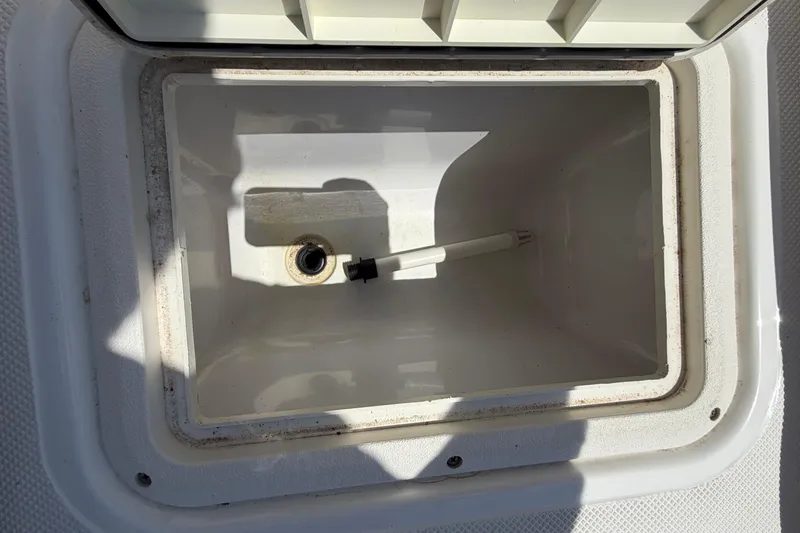 Slide: The Image of Open storage compartment on 2016 Hurricane SunDeck 187 OB boat. - 8