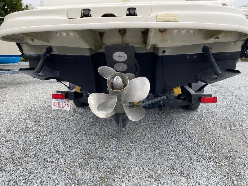 Slide: The Image of Rear view of a 2006 Sea Ray 240 Sundeck with trailer. - 3