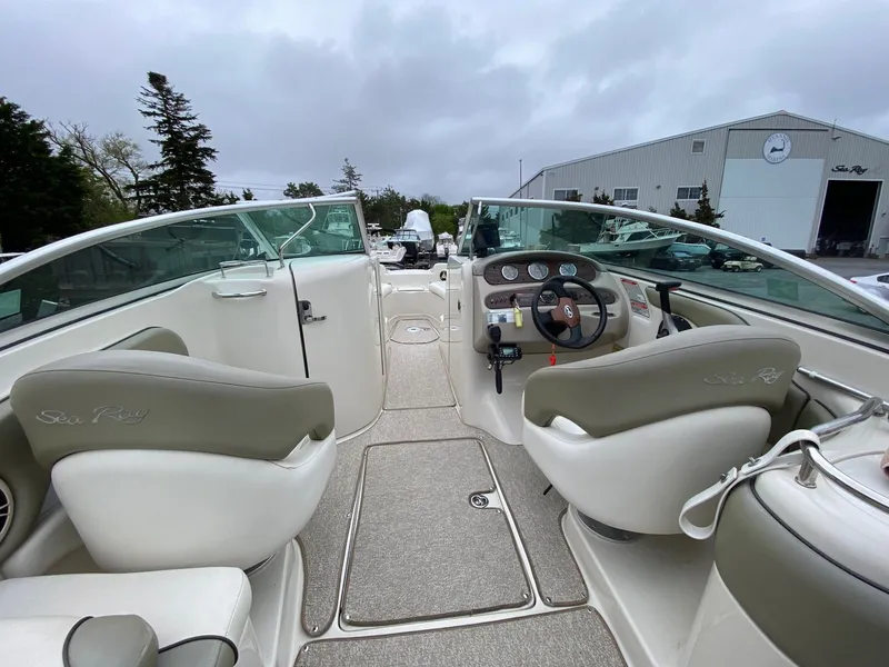 Slide: The Image of Interior of a 2006 Sea Ray 240 Sundeck boat with helm console. - 8
