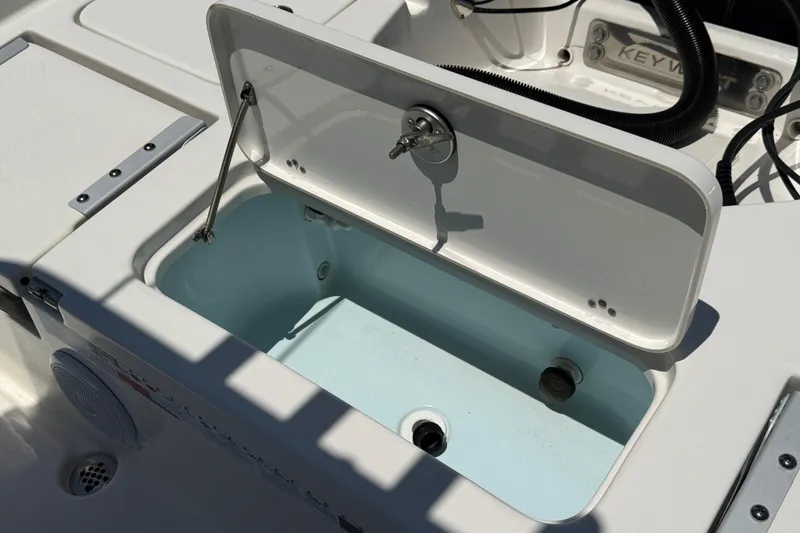 Slide: The Image of Open storage compartment on 2024 Key West 230 Bay Reef boat, showcasing interior design. - 17