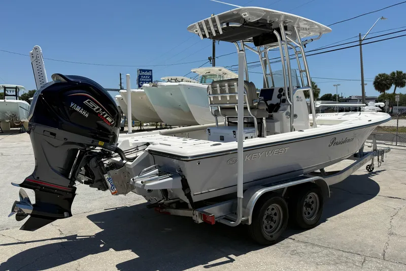 Slide: The Image of 2024 Key West 230 Bay Reef boat with Yamaha engine on trailer. - 4