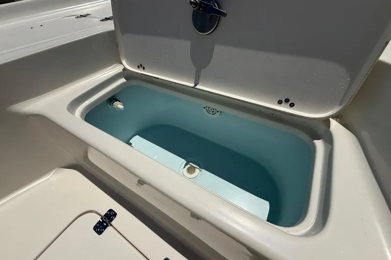 Slide: The Image of Open storage compartment on 2024 Key West 230 Bay Reef boat. - 7