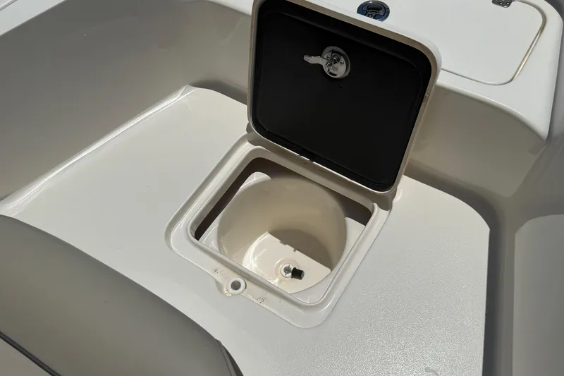 Slide: The Image of 2024 Key West 230 Bay Reef boat storage compartment with open lid. - 9