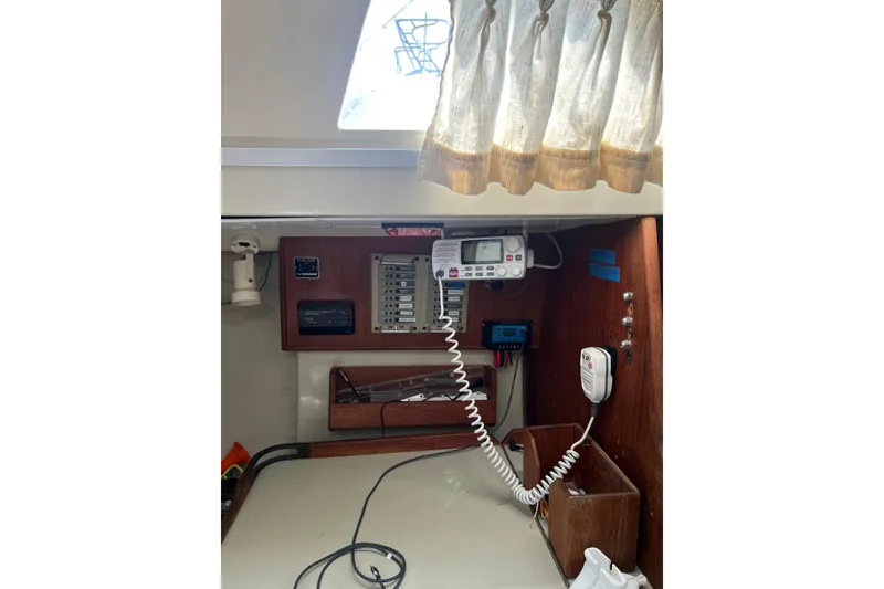 Slide: The Image of Interior of a 1981 C&C 34 sailboat featuring navigation equipment and communication devices. - 18