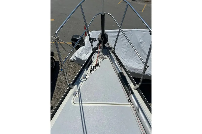 Slide: The Image of Bow view of a 1981 C&C 34 sailboat, showcasing deck and railing details. - 9