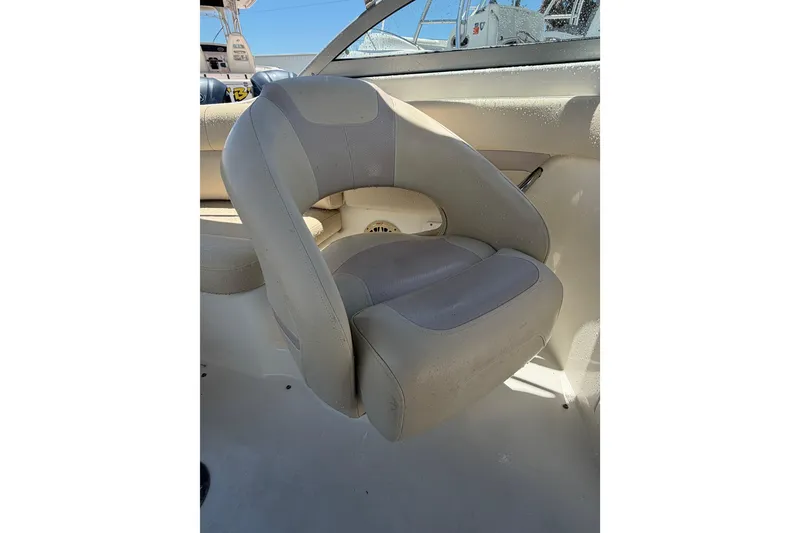 Slide: The Image of 2008 NauticStar 210 DC Sport Deck boat seat, beige upholstery, interior view. - 14