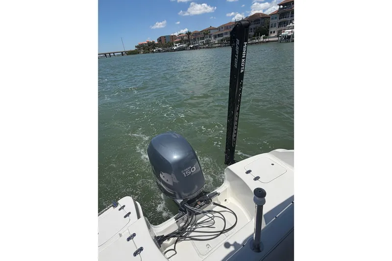 Slide: The Image of 2008 NauticStar 210 DC Sport Deck with Yamaha 150 engine on water. - 16