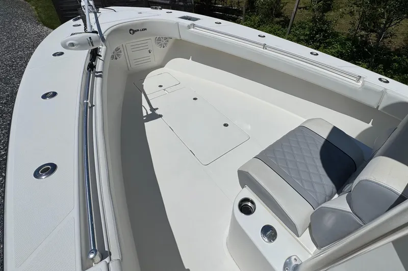 Slide: The Image of 2020 Sea-Lion 34 TE boat interior with cushioned seating and storage compartments. - 14