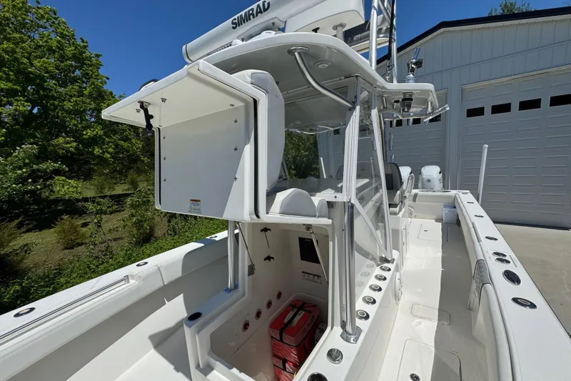 Slide: The Image of 2020 Sea-Lion 34 TE boat with center console and fishing rod holders. - 18