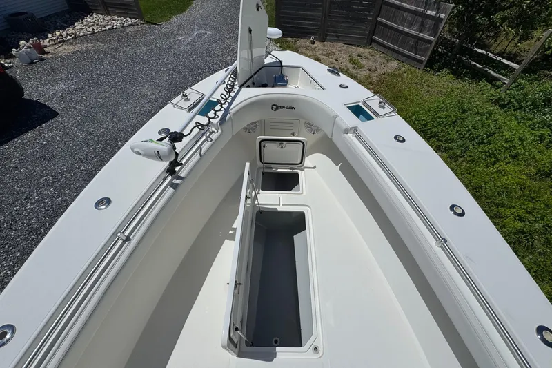 Slide: The Image of 2020 Sea-Lion 34 TE boat deck with open storage compartments and sleek design. - 21