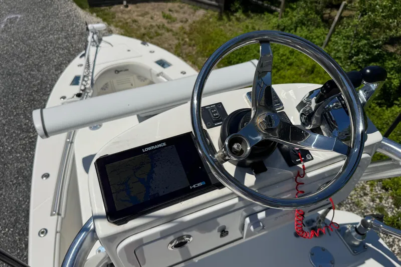 Slide: The Image of 2020 Sea-Lion 34 TE boat helm with steering wheel and navigation system. - 23