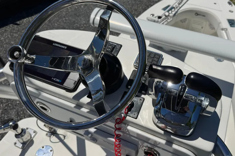 Slide: The Image of Steering console of 2020 Sea-Lion 34 TE boat with chrome wheel and controls. - 24