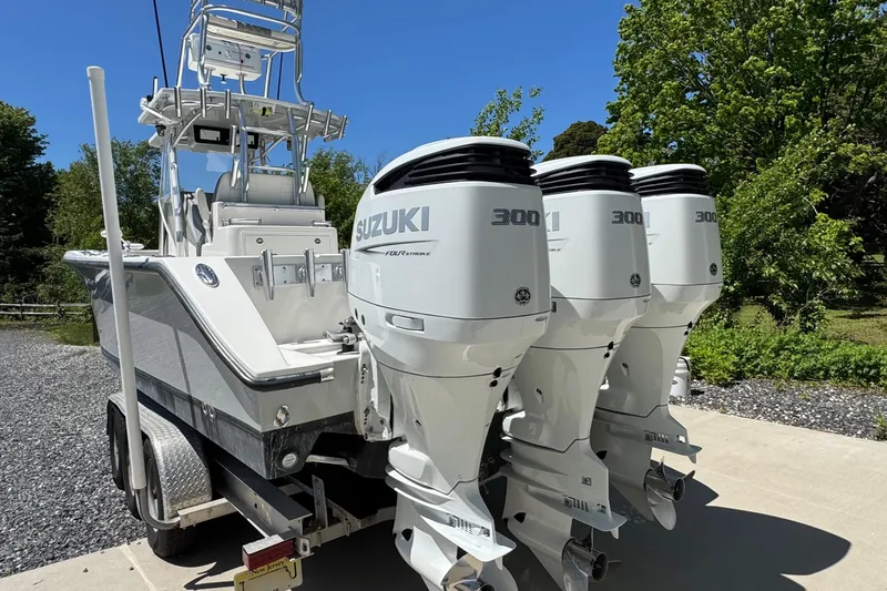 Slide: The Image of 2020 Sea-Lion 34 TE boat with triple Suzuki 300 outboard engines on a trailer. - 29