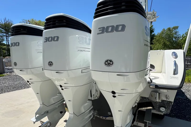 Slide: The Image of Triple outboard motors on a 2020 Sea-Lion 34 TE boat, showcasing power and performance. - 30