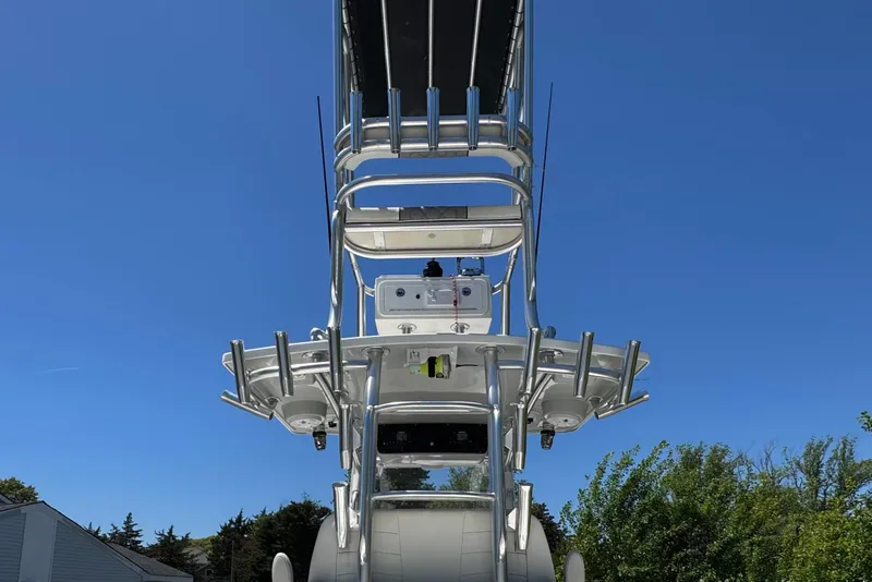 Slide: The Image of 2020 Sea-Lion 34 TE boat tower against clear blue sky, showcasing sleek design. - 31