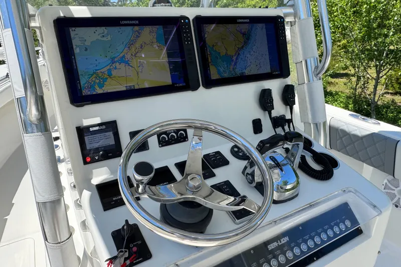Slide: The Image of Cockpit of 2020 Sea-Lion 34 TE boat with navigation screens and controls. - 6