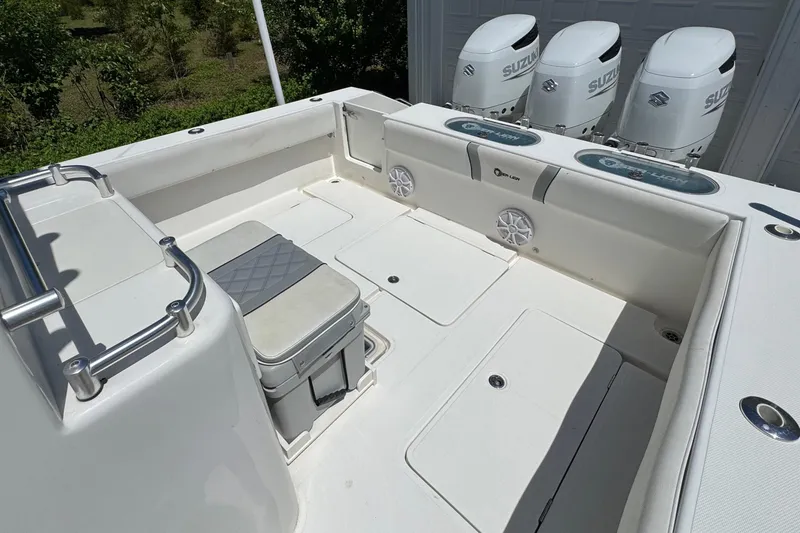 Slide: The Image of 2020 Sea-Lion 34 TE boat deck with Suzuki engines and seating area. - 9
