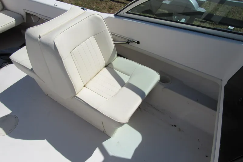 Slide: The Image of 2003 Grady-White Freedom 192 boat interior with white seating and windshield. - 11