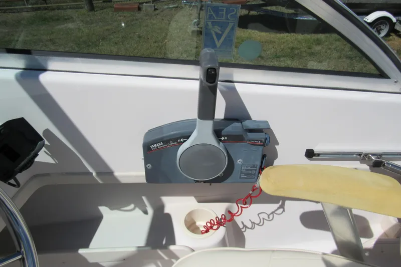 Slide: The Image of Control panel of a 2003 Grady-White Freedom 192 boat with Yamaha throttle. - 14