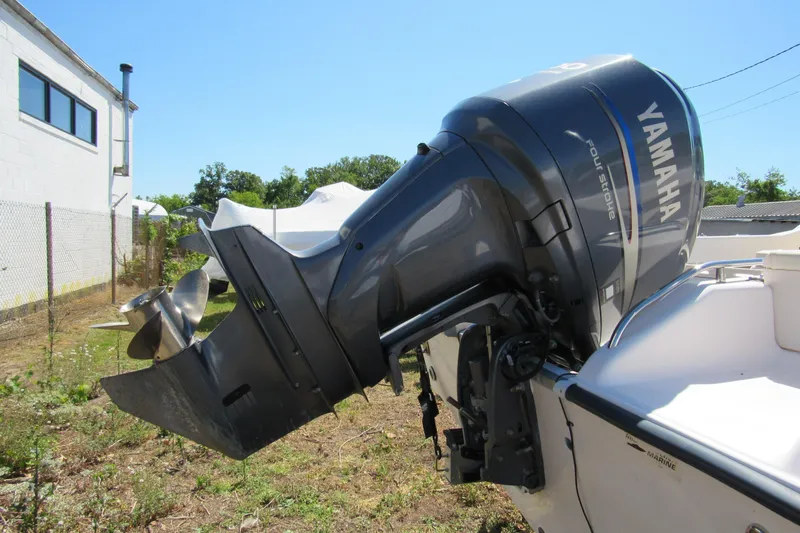 Slide: The Image of Outboard motor on a 2003 Grady-White Freedom 192 boat, featuring a Yamaha engine. - 5