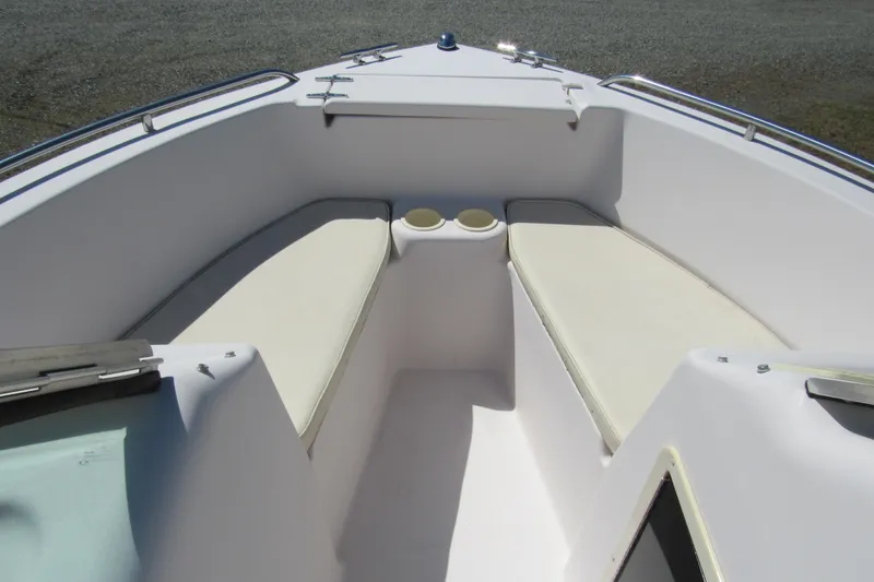 Slide: The Image of 2003 Grady-White Freedom 192 boat interior with cushioned seating and cup holders. - 7
