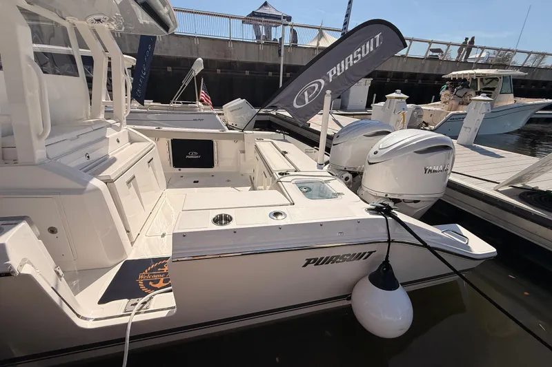 Slide: The Image of 2026 Pursuit S 328 Sport boat docked with Yamaha engines. - 10