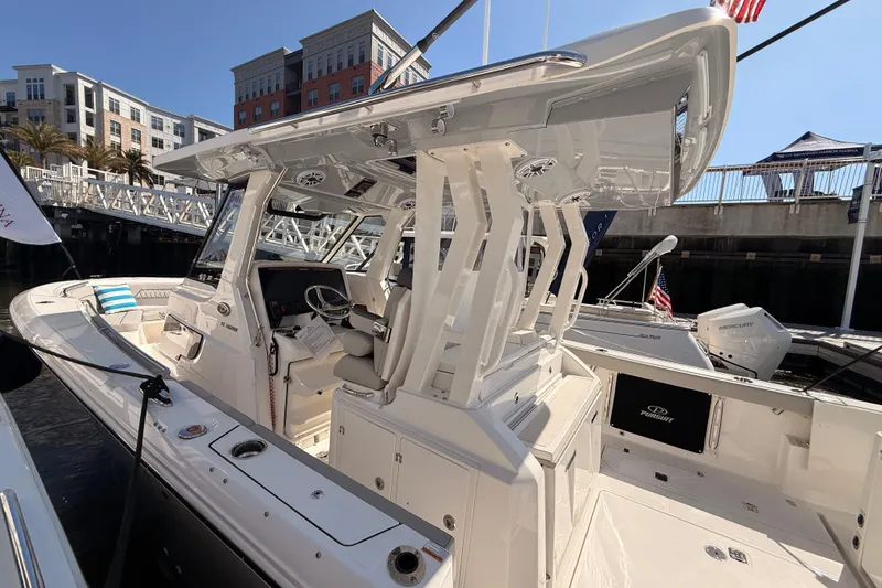 Slide: The Image of 2026 Pursuit S 328 Sport boat docked, modern design. - 11