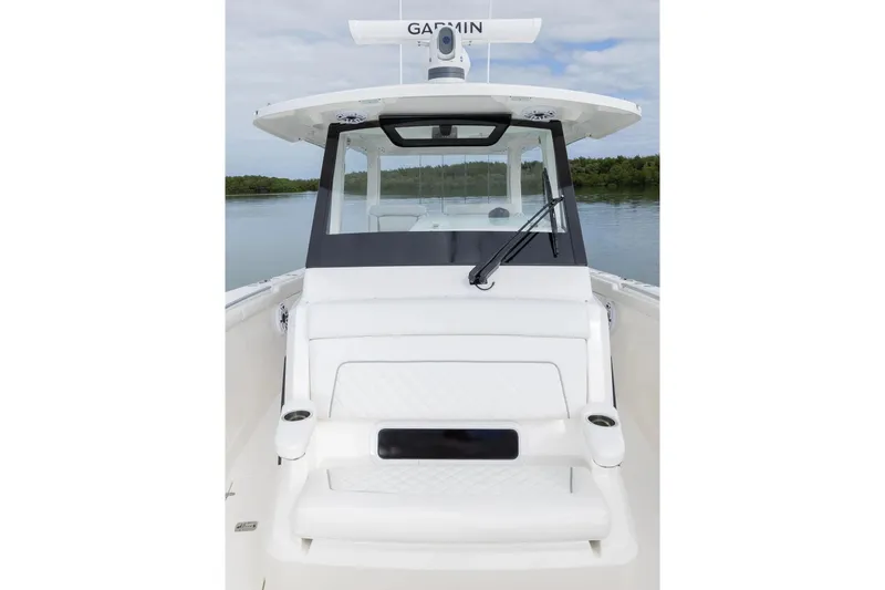 Slide: The Image of Manufacturer Provided Image: 2025 Pursuit S 328 Sport boat with sleek white seating and windshield. - 2
