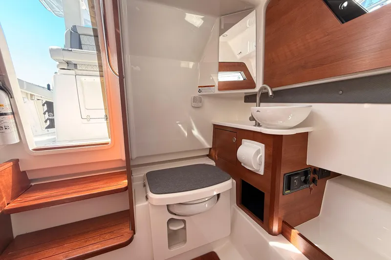 Slide: The Image of Luxurious 2026 Pursuit S 328 Sport boat interior with modern bathroom amenities. - 29