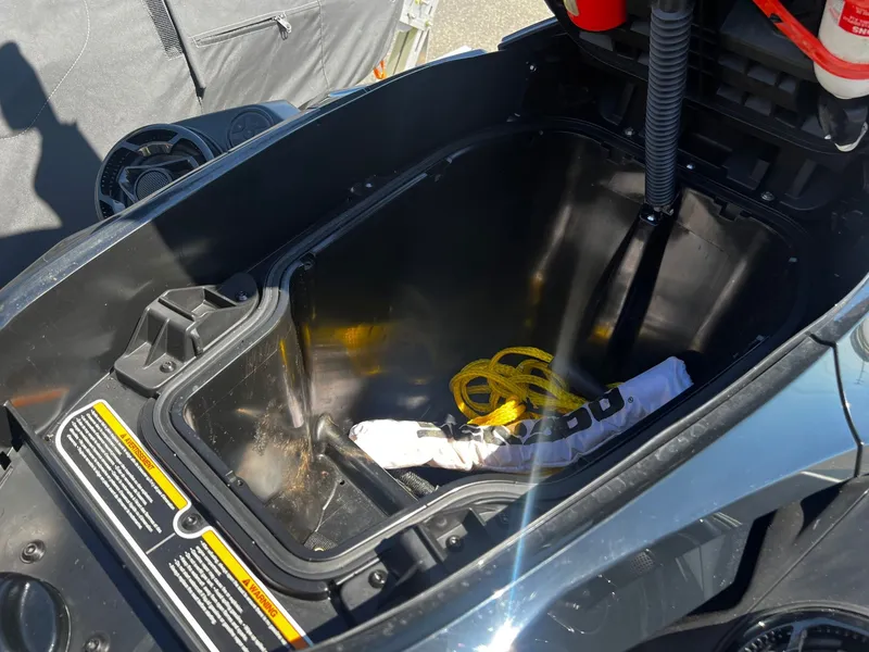 Slide: The Image of Sea-Doo GTX 230 storage compartment with yellow rope and accessories. - 5