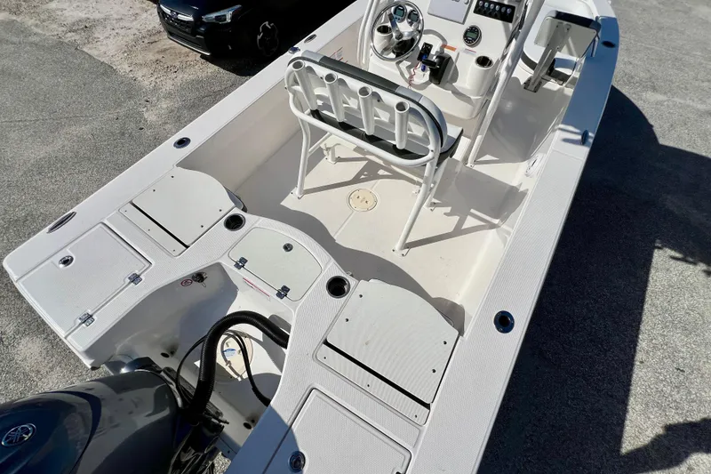 Slide: The Image of 2024 Robalo 206 Cayman boat interior with steering console and seating. - 10
