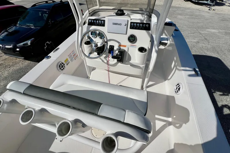 Slide: The Image of 2024 Robalo 206 Cayman boat interior with steering console and seating. - 12