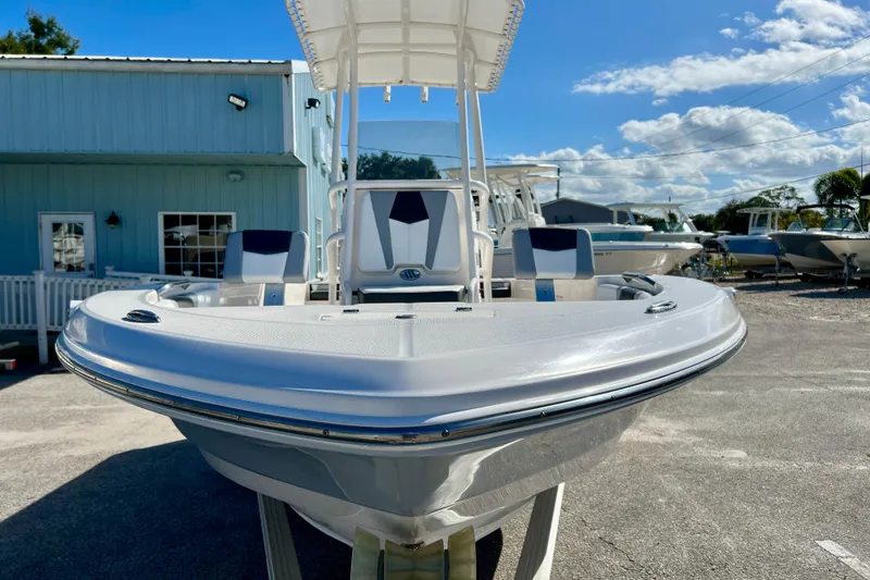 Slide: The Image of 2024 Robalo 206 Cayman boat displayed outdoors under a clear blue sky. - 3