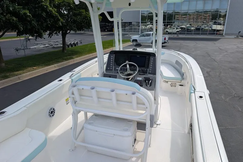 Slide: The Image of 2022 Robalo R242 Explorer boat interior with helm, seating, and console. - 13