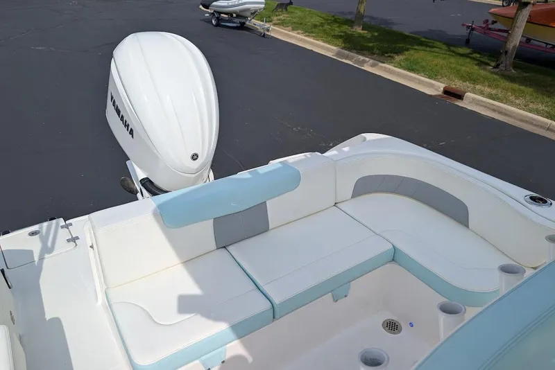 Slide: The Image of 2022 Robalo R242 Explorer boat with Yamaha engine, featuring spacious seating area. - 17