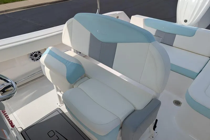 Slide: The Image of 2022 Robalo R242 Explorer boat interior with white and blue seating. - 21