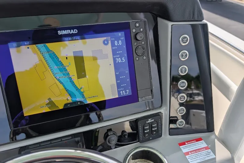 Slide: The Image of Simrad navigation display on 2022 Robalo R242 Explorer boat dashboard. - 26