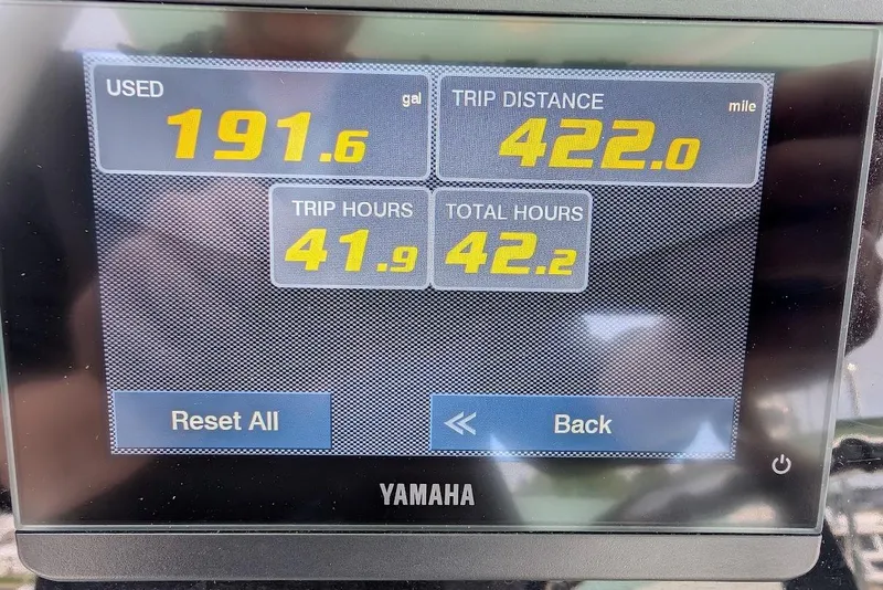 Slide: The Image of Yamaha display showing fuel usage, trip distance, and hours for 2022 Robalo R242 Explorer. - 29
