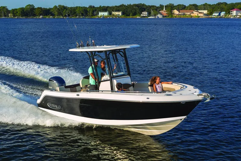 Slide: The Image of 2022 Robalo R242 Explorer boat on a lake. - 43