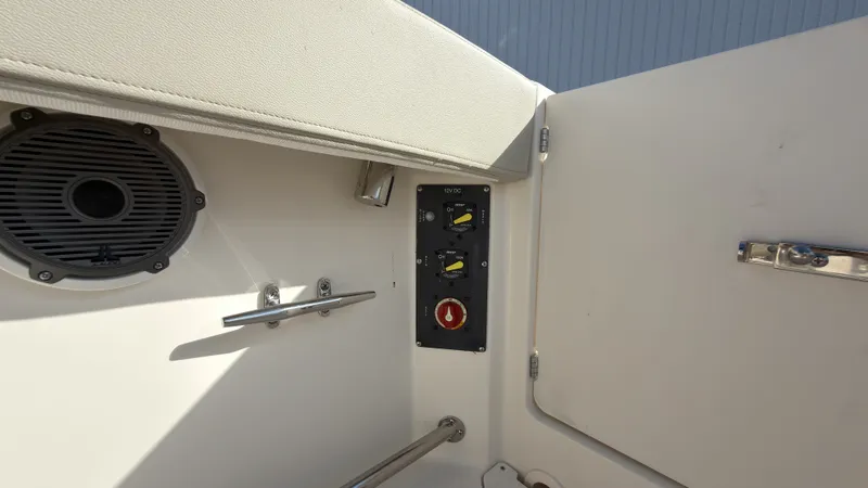 Slide: The Image of Interior view of a boat with speaker, switches, and stainless steel handles. - 38
