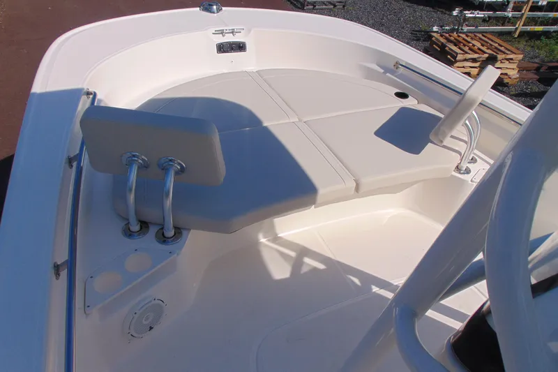 Slide: The Image of 2026 Boston Whaler 210 Montauk boat interior with cushioned seating and stainless steel fixtures. - 12