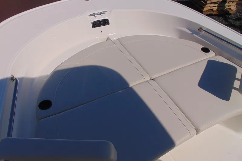 Slide: The Image of 2026 Boston Whaler 210 Montauk boat interior with cushioned seating area. - 13