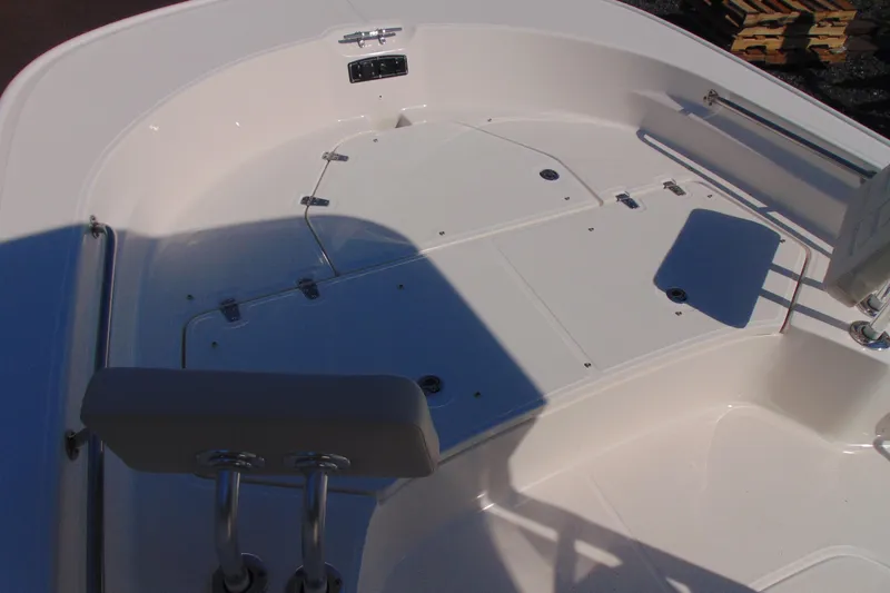Slide: The Image of 2026 Boston Whaler 210 Montauk boat deck, featuring spacious seating and storage compartments. - 14