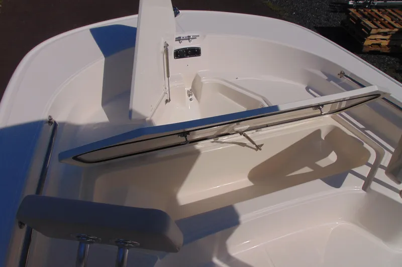 Slide: The Image of 2026 Boston Whaler 210 Montauk boat interior with open storage compartment. - 15