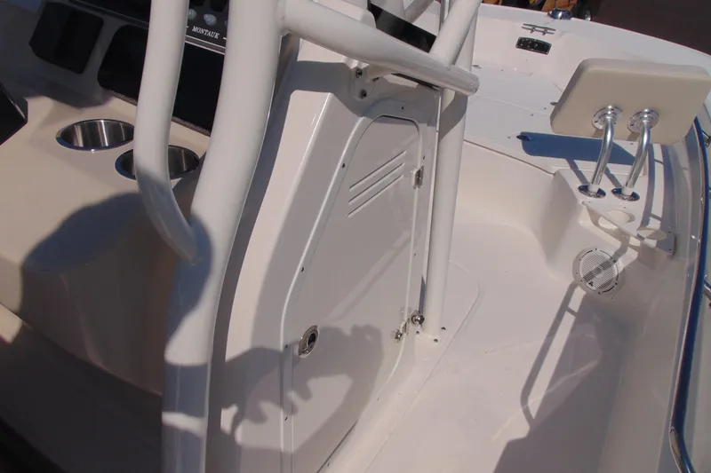 Slide: The Image of 2026 Boston Whaler 210 Montauk boat interior with console and seating area. - 16