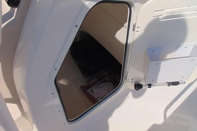 Slide: The Image of Storage compartment on a 2026 Boston Whaler 210 Montauk boat, showcasing interior space. - 17